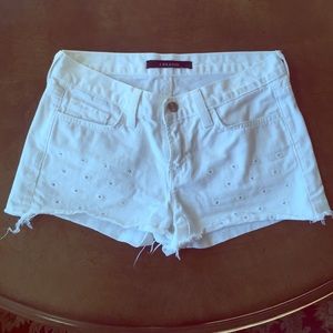 Authentic J Brand white cut off jean shorts.