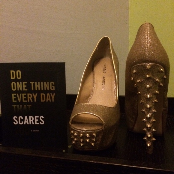 Gold spiked pumps