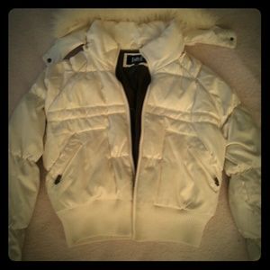 Cream colored winter coat.
