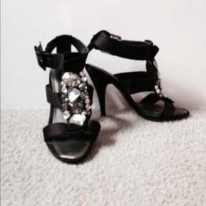 Black open toe heels with jeweled embellishments