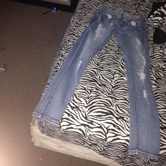 Light wash denim destroyed