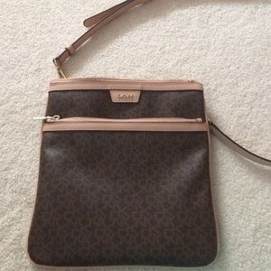 This is a DKNY purse with a long strap
