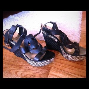 Shiny black and white GUESS wedges