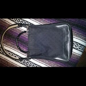 Black Gucci purse with bamboo handle