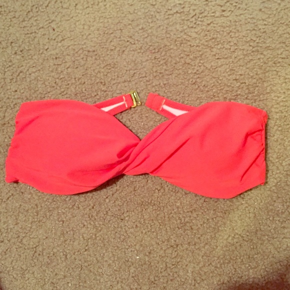 Coral strapless bathing suit top.