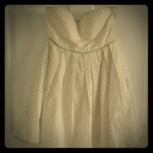 Strapless polka dot dress with contrast green trim