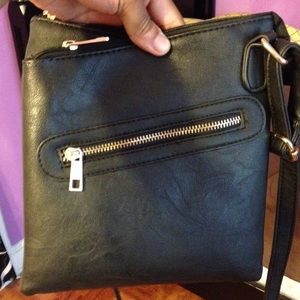 I'm selling this small black handbag