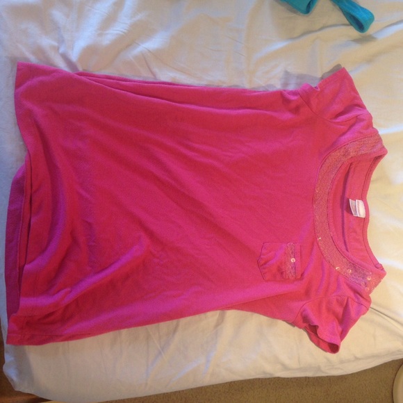 A pink sequenced shirt