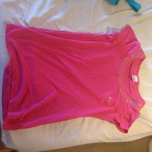 A pink sequenced shirt