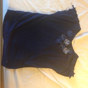 A navy blue shirt w/ flowers on the top.