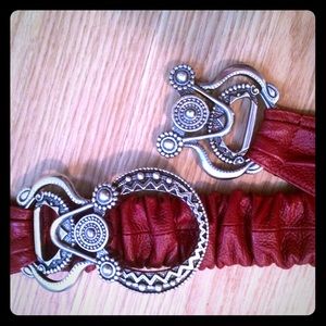 Red Chico's belt with detailed silver buckle