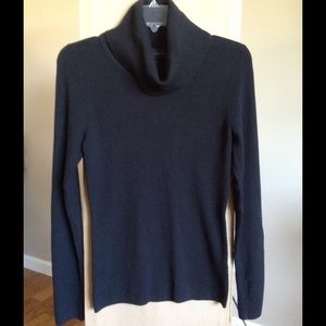 INVESTMENT Black turtleneck sweater.