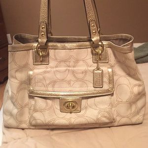 Shiny gold coach purse