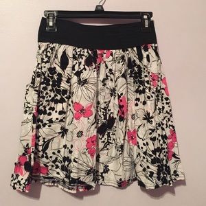 Black white and pink flower skirt.