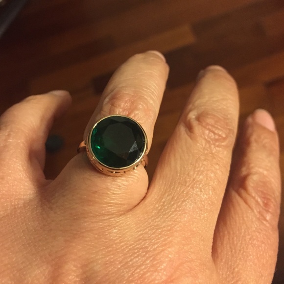 Gold /Rose tone ring with a large emerald stone
