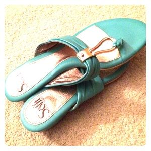 Adorable teal flip flops with gold center