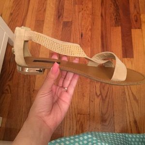 Beige sandals with gold detailing