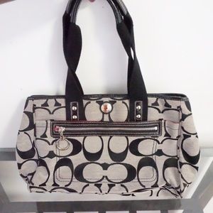 Coach purse with pink interior