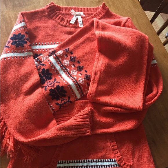 Orange and blue sweater. Matching scarf, etc