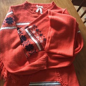 Orange and blue sweater. Matching scarf, etc