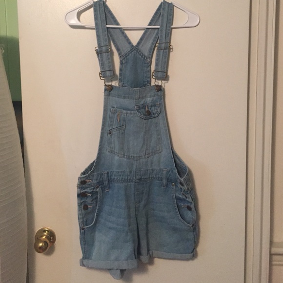 Light denim overall shorts.