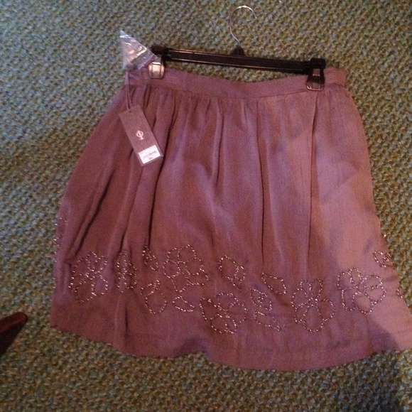 Gray skirt with flower designs on the bottom