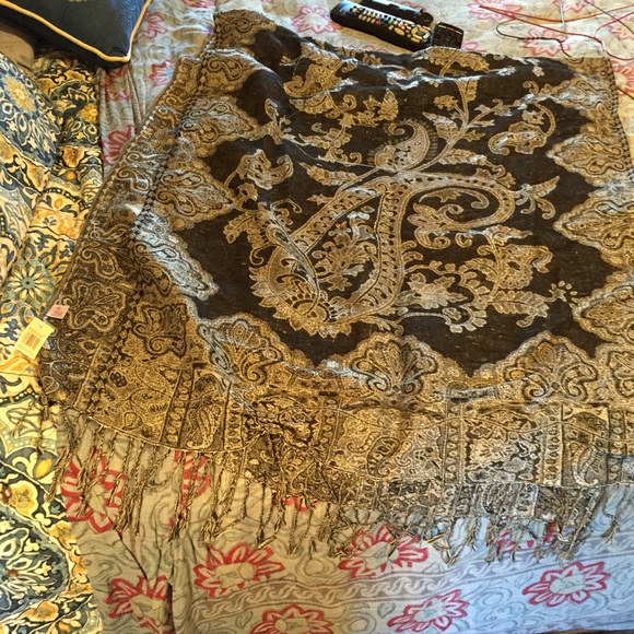 Two pashmina scarves, one of each color.