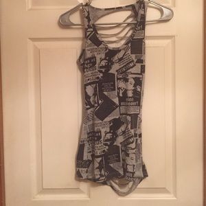 Asymmetrical cut out newspaper theme tank
