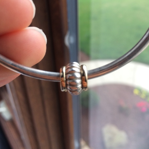 A real sterling silver/ 14k gold pandora charm