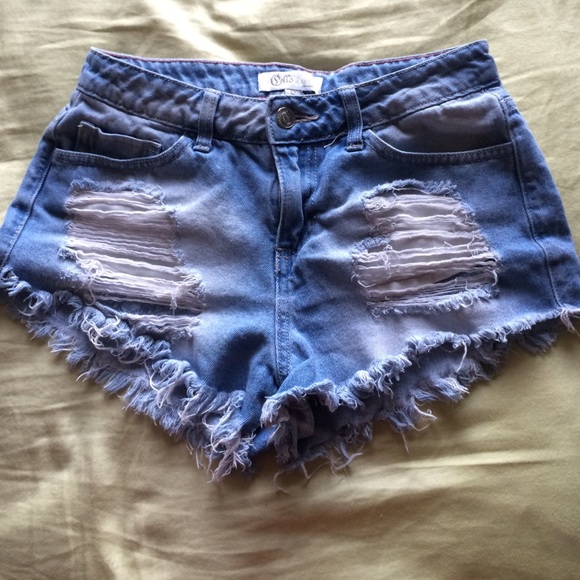 Distressed light denim shorts