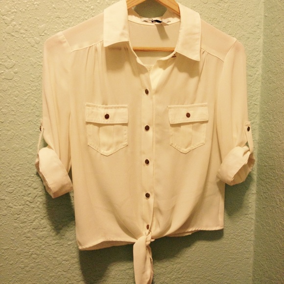 Beige shirt with tie at the bottom