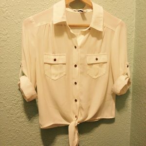 Beige shirt with tie at the bottom