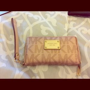 Rose gold Michael Kors wristlet/wallet