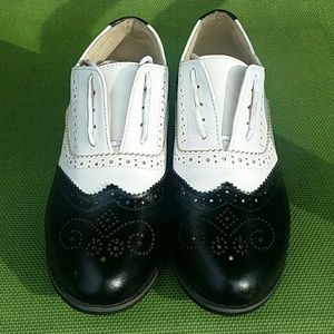 Wingtip black and white oxfords