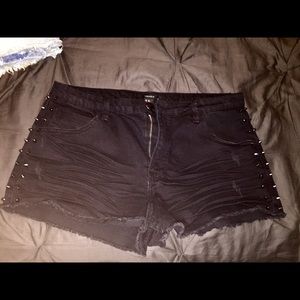Black studded denim shorts