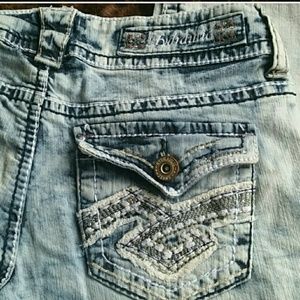 Hydraulic /distress faded jeans.