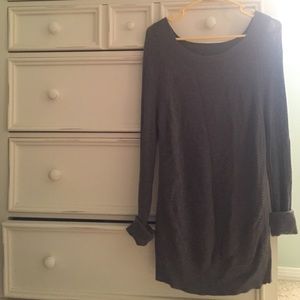 It is a dark grey sweater.