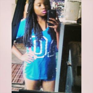 Blue jersey shirt with number ten .