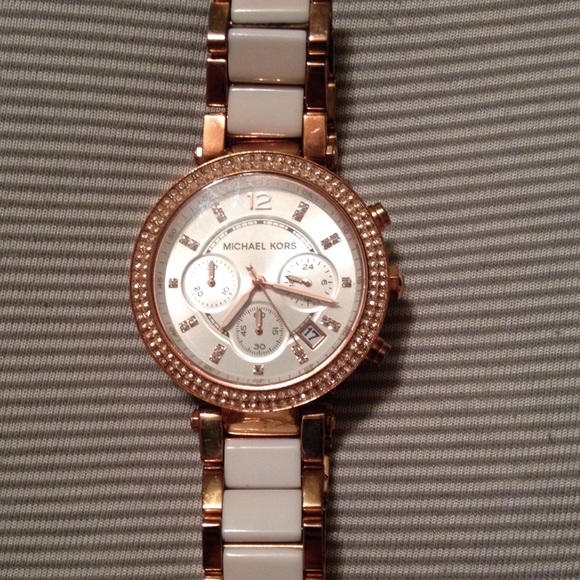 Mk rose gold/white watch.