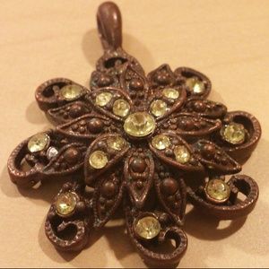 Bronze and pale green colored pendant