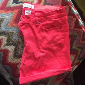 Shorts. Stretchy, cuffed. bright coral/red.