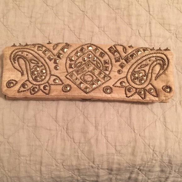 Tan embellished clutch