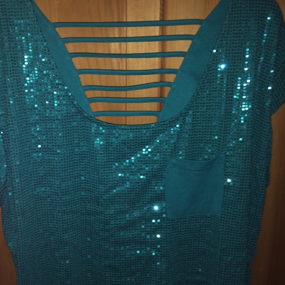 A sparkly blue cut out shirt