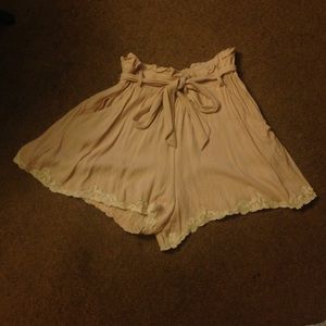 Blush colored lace trim shorts with pockets