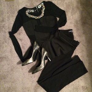 Black peplum with mesh paneling