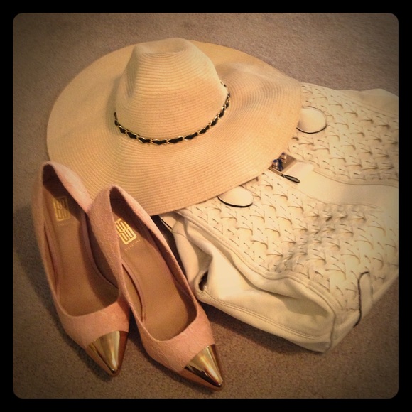 Pink lace pumps with gold toe.