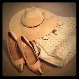 Pink lace pumps with gold toe.