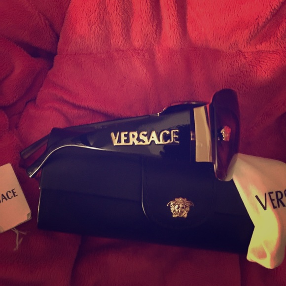 Authentic Versace sunglasses with bag and case.