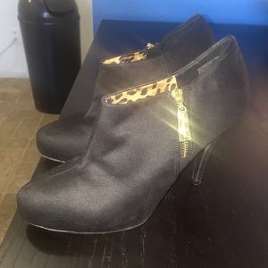 All black 3 1/2 inch high heel closed toe shoes