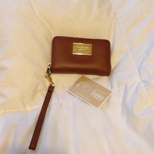 Michael Kors wristlet / wallet in luggage